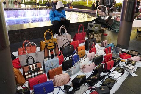 can you get in trouble for selling fake designer bags|selling designer handbags.